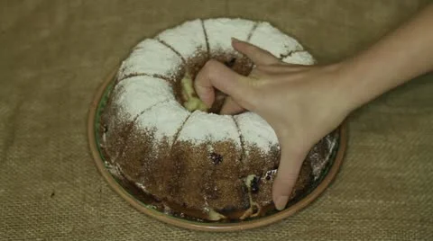 Hands take home made cake Stock Footage 20444609