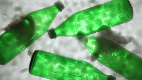 Hands take out two green bottles with water or soda from ice water. Stock Footage 149193020