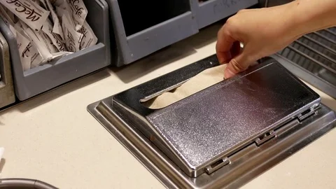 Hands take paper napkin inside Mcdonald restaurant with 4k resolution. Stock Footage 77861894