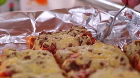 Hands take a piece of pizza behind which the cheese stretches. Stock Footage 197340451