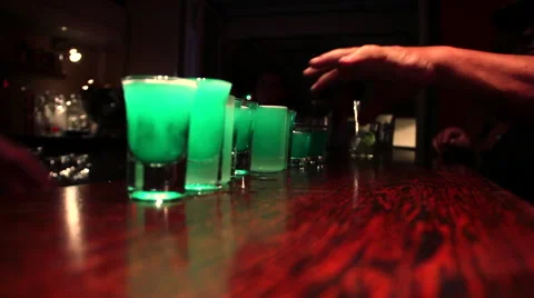 Hands taking alcohol shots 스톡 동영상 48988287