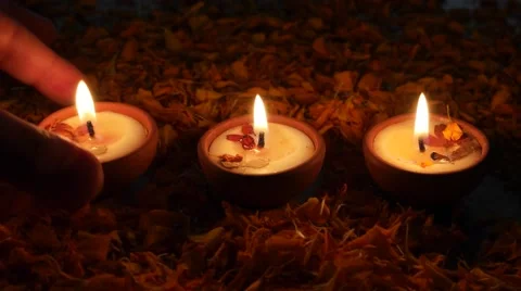 Hands taking away and brining back a Traditional clay diya Stock Footage 68767753