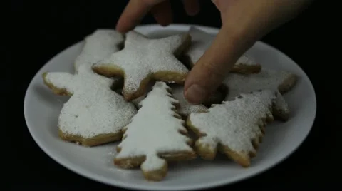 Hands taking Christmas cookie Video stock 12554407