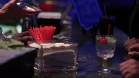 Hands taking cocktail from bar background 스톡 동영상 102773001