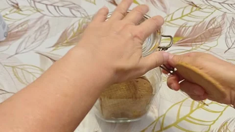 Hands taking a cookie, Marina di Carrara, September 14, 2026, Italy Stock Footage 345489513