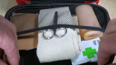 Hands taking items from a first aid kit box. Stock Footage 130394018