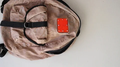 Hands taking items out of old-school backpack Stock Footage 106085457