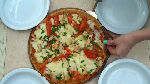 Hands taking pizza cuts from plate on table. Top view Stock Footage 89227654