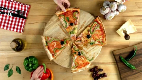 Hands taking pizza cuts from plate on table. pizza with mozzarella cheese Vídeos de archivo 336586718