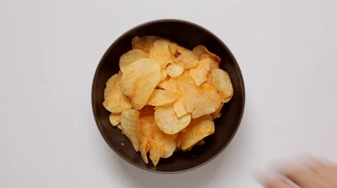 Hands taking potato chips Stock Footage 51589333