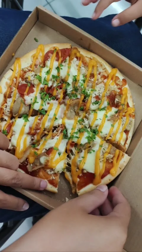 Hands taking a slice of delicious pizza with melted cheese. Stock Footage 340177035