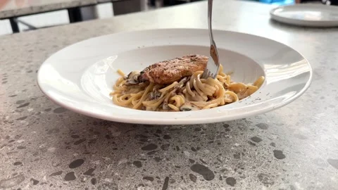 Hands taking spaghetti served on a table 스톡 동영상 287582618