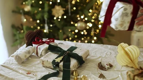 Hands taking stylish christmas gift with spruce branch Stock Footage 289475100