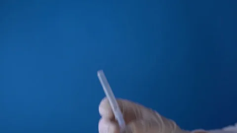 Hands taking off syringe cap Video stock 128798024