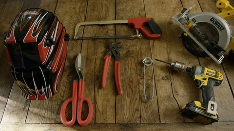 Hands taking tools from wooden shelf Stock Footage 127957439