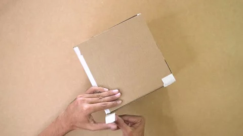 Hands Taping Cardboard Box Close Up Video stock 327503857