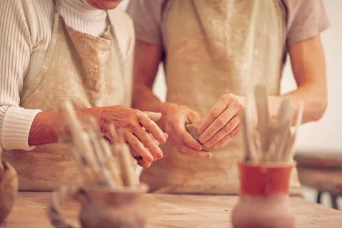 Hands of a teacher and her apprentice Stock Photos