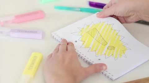 Hands tearing and crumpling notebook page with exclamation sign on white desk Stock Footage 331802192