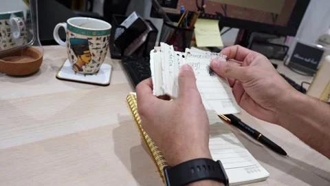 Hands Tearing Handwritten Notes On Desk Stock Footage 340302055
