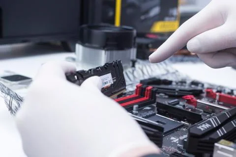 Hands of a technician assembling computer hardware parts new cpu is being mou Stock Photos