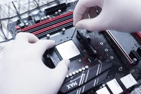 Hands of a technician assembling computer hardware parts new cpu is being mou Stock Photos