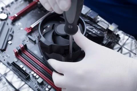 Hands of a technician assembling computer hardware parts new cpu is being mou Stock Photos