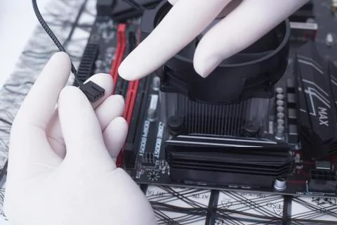Hands of a technician assembling computer hardware parts new cpu is being mou Stock Photos