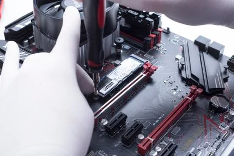 Hands of a technician assembling computer hardware parts new cpu is being mou Stock Photos
