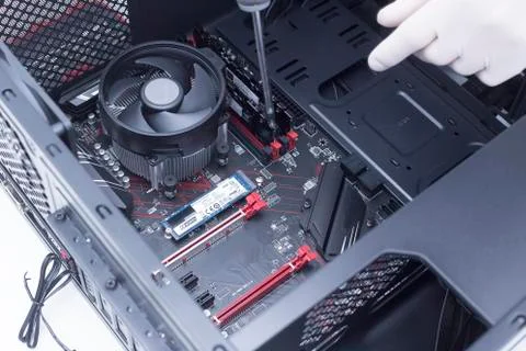 Hands of a technician assembling computer hardware parts new cpu is being mou Stock Photos