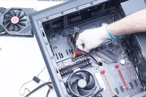 Hands of a technician assembling computer hardware parts new cpu is being mou Stock Photos