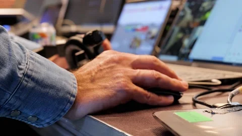 Hands of a technician on the computer mouse during a live broadcast Stock Footage 168674927