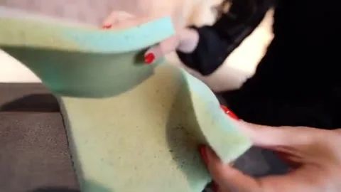 Hands Test Flexible Green Foam for Texture and Bendability Video stock 319461842