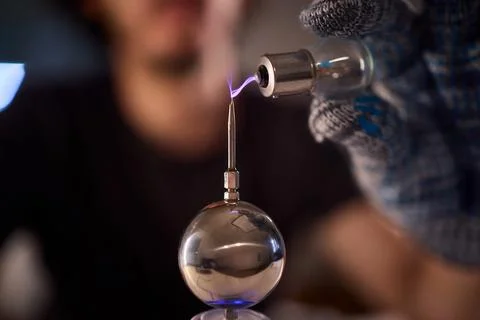Hands test plasma, Detailed image of electrical discharge testing process Stock Photos