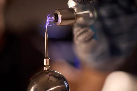 Hands test plasma, Detailed image of electrical discharge testing process Stock Photos