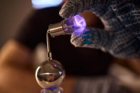 Hands test plasma, Detailed image of electrical discharge testing process Stock Photos