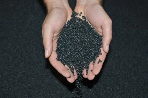 Hands testing synthetic material Stock Photos