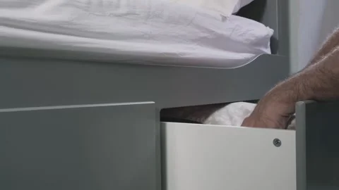 Hands of thief swiftly opening drawer and grabbing thick stack of dollar bills Stock Footage 297255705