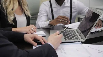 Hands of three multi-enthic colleagues who are working in the office. Stock Footage 85555686
