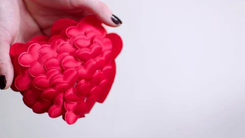 Hands throwing red heart and it crashing Stock Footage 71611869