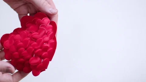 Hands throwing red heart and it crashing Stock Footage 71612186