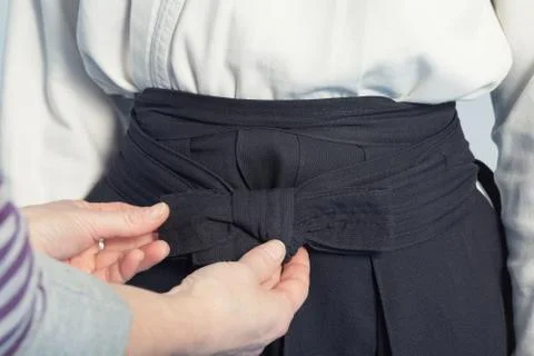 Hands that tie a hakama Stock Photos