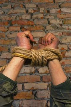 Hands tied up with rope Stock Photos