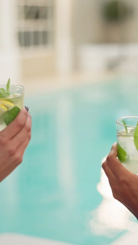 Hands, toast and mojito at pool, celebration and vacation for friends, bonding Stock Footage 321813978