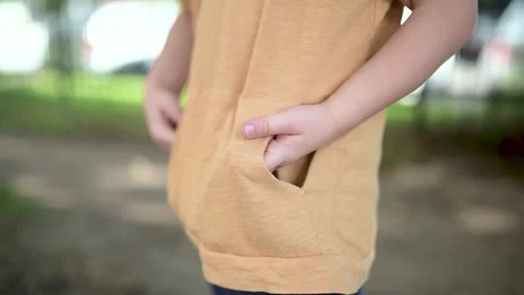 Hands of toddler boy picking and opening chestnuts in park on a sunny autumn day 스톡 동영상 255808846