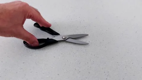 Hands-On Tool Demo: Serrated Kitchen Scissors on Neutral Surface Video stock 318641083