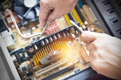 Hands with tools for repairing computer 스톡 사진
