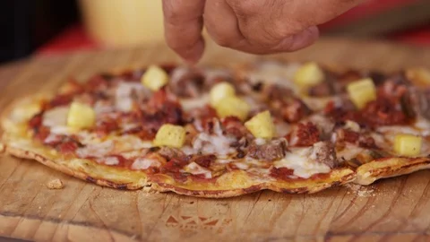 Hands topping pizza with pineapple RED 4K.R3D slowmo close up Stock Footage 103398841