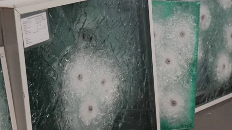 Hands Touch the Glass Sheets in Frames, Glass With Bullet Holes, Tested Glass, Stock Footage 53011105