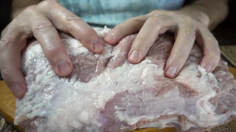 Hands touch a raw meat in slow motion Stock Footage 128800698