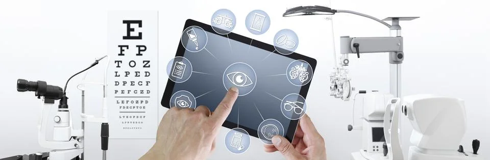 Hands touch screen of digital tablet with ophthalmologist and optometrist ico Foto stock